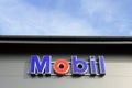 Sign Mobil on a Shop Wall with Blue Sky