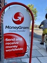 The sign of MoneyGram in front of a local grocery store, London