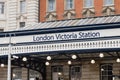 Sign with name on awning for London Victoria Station train terminus