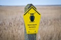 Sign National Park Core Zone on the Baltic Sea. Symbol owl with yellow background