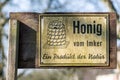 Sign near the road - Honey from the beekeeper - a product of nature (Honig vom Imker ein produkt der natur Royalty Free Stock Photo