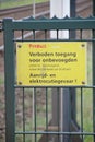 Sign no trespassing and copper marked at railway tracks to prevent theft and walkers along the track.