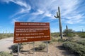 Sign at Organ Pipe National Monument, near the US and Mexico border, warns visitors to be aware of drug cartels and illegal Royalty Free Stock Photo