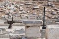 Sign at the outdoor ancient theatre on the Greek island of Delos