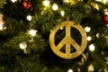a sign of pacifism as a Christmas tree decoration. stop the war concept. Christmas natural fir tree decorated with toys garland