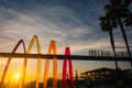 Sign and palm trees at sunset in Imperial Beach, California. Royalty Free Stock Photo