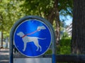 sign in park that means walking dog only on leash. Royalty Free Stock Photo