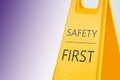 Sign with phrase SAFETY FIRST on background, space for text