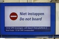 Sign at platform with \'Do not board\' or Niet Instappen in Dutch Royalty Free Stock Photo