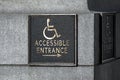 Sign pointer direction motion the wheelchair on the building corne