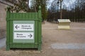 A sign pointing to Musee de l\'Orangerie and Musee du Louvre in Jardin des Tuileries in Paris, France