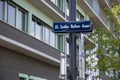 A sign on a pole with the name of the Lydia-Sicher-Gasse street in Vienna Royalty Free Stock Photo