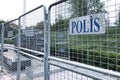 sign police in Turkish language on metallic borders barricades Royalty Free Stock Photo