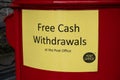 Sign on post box indicating free cash withdrawals Betws-y-coed North Wales March 2020