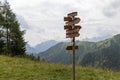 Sign post showing hiking paths in the Dolomites Alps, Italy