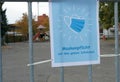 A sign poster in German language saying a face mask is obligatory on school ground.