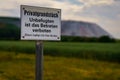 Sign: Private land, no entry for unauthorised persons, Parents are liable for their children German Royalty Free Stock Photo