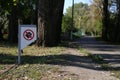 Sign prohibiting dogs from walking in the park Royalty Free Stock Photo