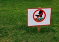 A sign prohibiting walking on the lawn Royalty Free Stock Photo