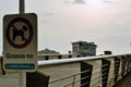 Tossa de Mar, Spain, August 2018. A sign on the prohibition of dog walking on the beach on the background of the dawn.