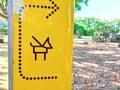 Sign in a public park allowing dogs to be walked on a leash Royalty Free Stock Photo