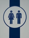 Sign of public restroom for female and male. Man and woman toilet, WC. White and blue stripes background Royalty Free Stock Photo