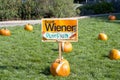 Sign by Pumpkins on the grass for Senator Scott Wiener\'s Halloween Pumpkin Carving Event Royalty Free Stock Photo