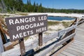 Sign - Ranger-led program meets here, in front of Abyss Pool, for tours and guides of West Thumb Geyser Basin in Yellowstone Royalty Free Stock Photo