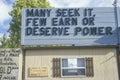 A sign that reads Many seek it, few earn or deserve power