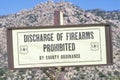 A sign that reads Ã¯Â¿Â½Discharge of firearms prohibitedÃ¯Â¿Â½