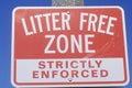 A sign that reads Ã¯Â¿Â½Litter Free Zone Strictly EnforcedÃ¯Â¿Â½ Royalty Free Stock Photo