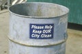 A sign that reads Ã¯Â¿Â½Please help keep OUR city cleanÃ¯Â¿Â½