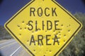 A sign that reads Ã¯Â¿Â½Rock Slide AreaÃ¯Â¿Â½