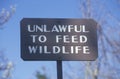 A sign that reads Ã¯Â¿Â½Unlawful to feed wildlifeÃ¯Â¿Â½