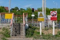 Sign red stop signal for pedestrians at traffic lights and warning signs Royalty Free Stock Photo