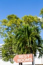 Sign for Rest Rooms Under Palm Tree Royalty Free Stock Photo