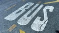 Sign on road bus, detail of a sign painted on the asphalt, information and indication signal Royalty Free Stock Photo