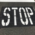 Sign on the road `STOP`
