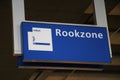Sign Rookzone in dutch on the Den Haag Centraal railway station to indicate the zone where smoking is allowed