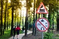 Sign of the rules of the road. Road sign Riding train, traffic is prohibited for bicycles and motor vehicles. Railway crossing. Royalty Free Stock Photo