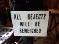 Sign saying all rejects will be reweighted