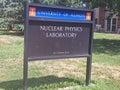 Sign Saying Nuclear Physics Laboratory in University of Illinois, Urbana Champaign, on a Grassy Lawn