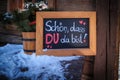 on a sign it says in german : schoen, dass du da bist