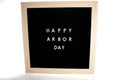 A Sign That Says Happy Arbor Day On a White Background