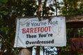 a sign that says if you're not barefoot then you are overdressed