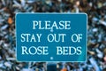 Please stay out of Rose beds Royalty Free Stock Photo