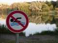 The sign says swimming is prohibited. Place where it is forbidden to swim Royalty Free Stock Photo