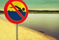 No swimming sign over a lake