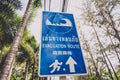 A sign showing a tsunami evacuation route at island in Thailand