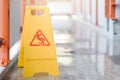 Sign showing warning of caution wet floor at airport